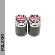 Two black cylindrical Brompton Union Jack Valve Cap containers (Schrader, A/C/G Line) by FOLDRIO feature silver tops and a Union Jack design, side by side on white, with FOLDRIO written vertically on the left.