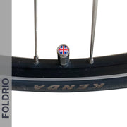 Close-up of a Brompton Union Jack Valve Cap by FOLDRIO (Schrader, A/C/G Line) on a bicycle wheel—ideal for those after stylish and unique Brompton valve accessories.