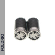 Two cylindrical metallic Brompton Union Jack Valve Caps – Schrader (A/C/G Line) by FOLDRIO, featuring star-shaped end patterns, are placed side by side on a white background with "FOLDRIO" vertically on the left.
