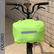Brompton Brompton S Bag in neon yellow with a reflective strip and FOLDRIO logo, fitted to the front basket near a brick wall | Foldrio. Foldrio