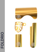 Four gold metal Brompton Frame Protector Set with British Flag cutouts by FOLDRIO—including shield-shaped chainstay guard and rear fork cover—are shown on a white background with “FOLDRIO” vertically on a gray bar at left.