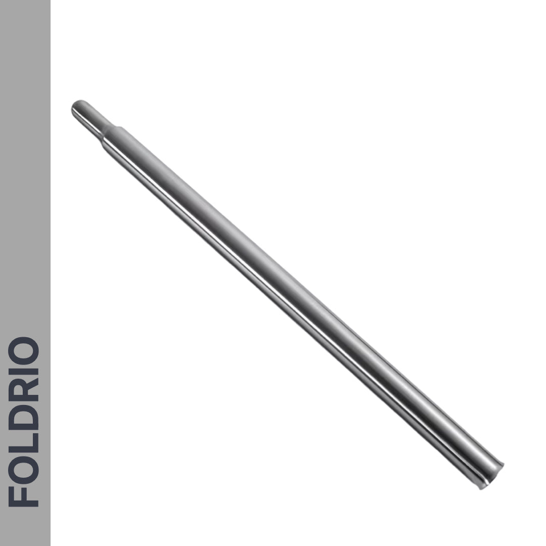 A slim, metallic Brompton Titanium Seatpost – Lightweight Upgrade (560mm & 580mm), made from GR9 titanium alloy, with a slightly rounded tip is shown on a white background. "FOLDRIO" appears vertically on a gray strip on the left.