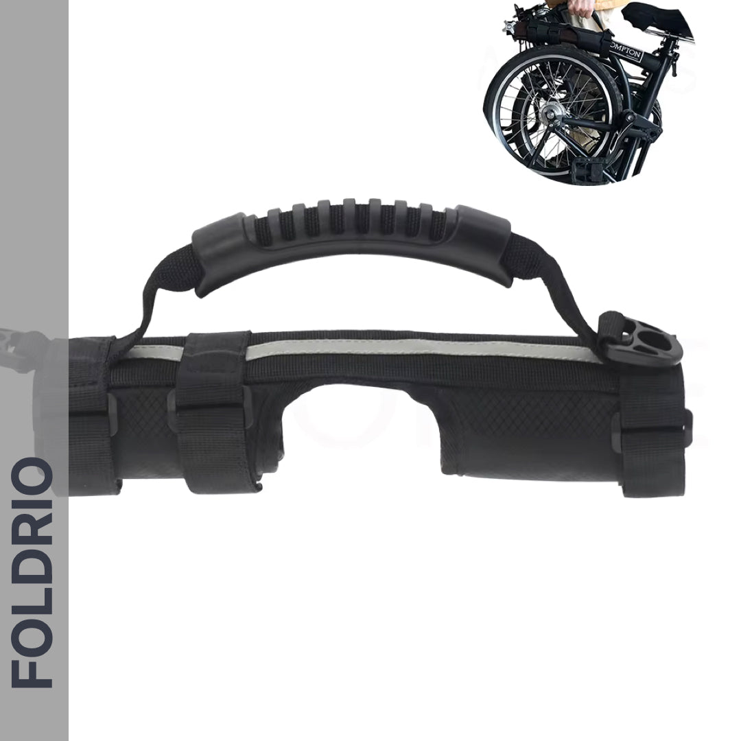 A Brompton Carry Handle & Shoulder Strap – Folded Bike Carrier is shown with padded handle and FOLDRIO straps. In the corner, a small image shows someone carrying a folded bike using a similar handle.