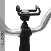 Close-up of the FOLDRIO Brompton Phone Mount—lightweight and adjustable, no case needed—featured against a white background, with "FOLDRIO" shown vertically on a gray strip to the left.
