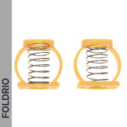 Two metal Brompton Stem Fixing Buckle Springs stand upright in yellow plastic frames. FOLDRIO, the brand name, is printed vertically on a gray strip along the left side. The background is white.