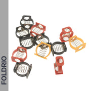 Several FOLDRIO Brompton Stem Fixing Buckle Springs in red, black, and yellow holders are scattered on a white background. The brand name FOLDRIO is displayed vertically on a grey strip along the left side.