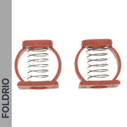 Two Brompton Stem Fixing Buckle Springs by FOLDRIO, each a metal coil spring in a red circular plastic frame, are side by side on a white background. “FOLDRIO” is vertically in bold black letters on a gray strip at the left edge.