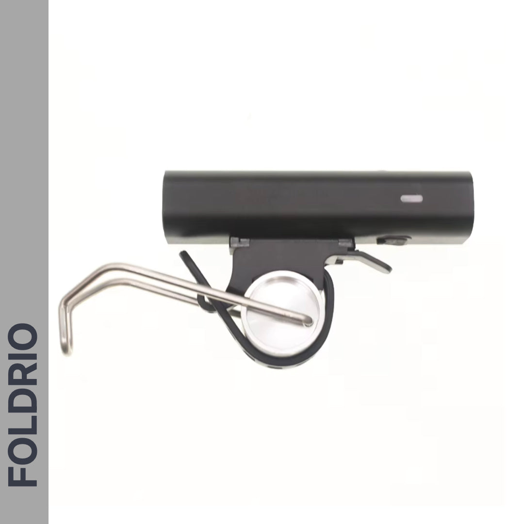 A black and silver quick release lever with FOLDRIO branding is shown beside the Brompton Front Fork Light – a sleek, USB-C rechargeable 400-lumen bike light by FOLDRIO, set against a white background for enhanced visibility.