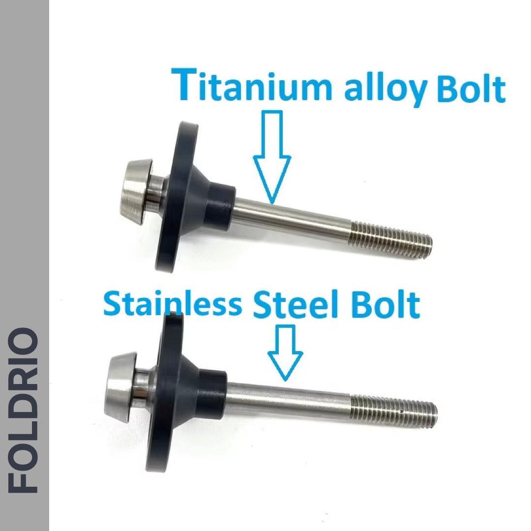 Two metal bolts, labeled Titanium and Stainless Steel, both partially threaded with arrows pointing to each. FOLDRIO branding on a gray stripe at left—perfect upgrade for Brompton Folding Bike using the FOLDRIO Rear Shock Absorber.