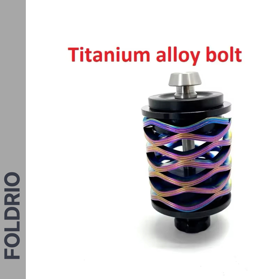 A cylindrical Brompton Rear Shock Absorber with a colorful, wavy metallic design and silver titanium alloy bolt on top—perfect for your Brompton Folding Bike. "Titanium alloy bolt" is above and FOLDRIO appears vertically on the left.