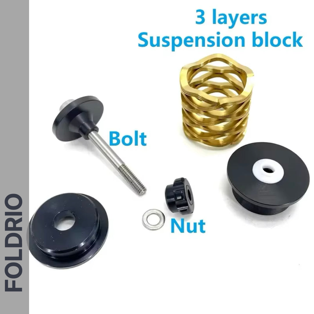 Black and gold FOLDRIO Brompton Rear Shock Absorber components—Bolt, Nut, and 3-layer suspension block—are arranged on a white background. The brand name FOLDRIO appears vertically on the left side.