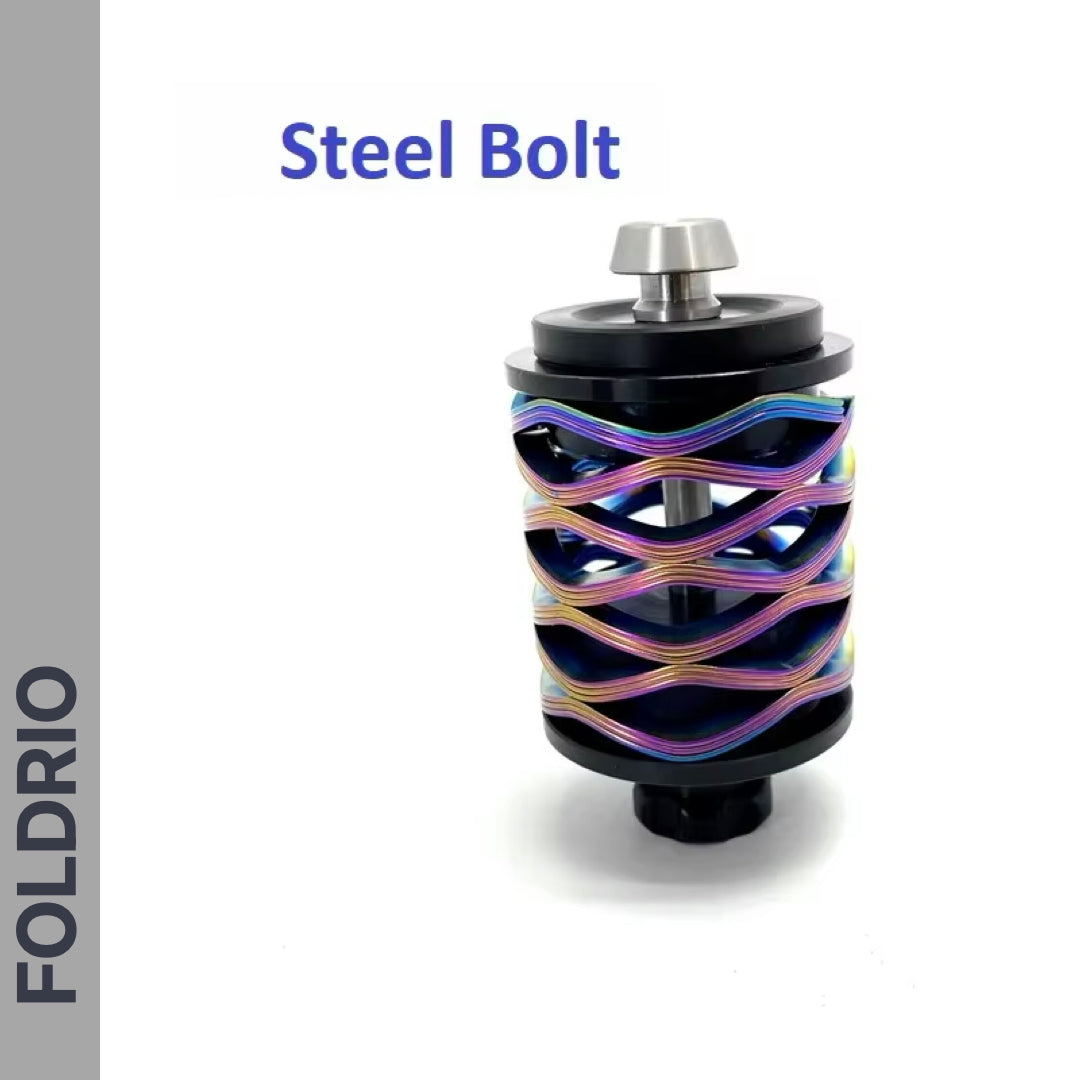 A metal device labeled Brompton Rear Shock Absorber by FOLDRIO features a cylindrical core and a colorful, wave-like exterior; the word FOLDRIO appears vertically on the left side.