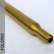 A close-up of the Brompton Titanium Seatpost – Multicolour Edition by FOLDRIO, a metallic gold cylindrical tube on a white surface. "FOLDRIO" is displayed vertically along a gray sidebar on the image's left side.
