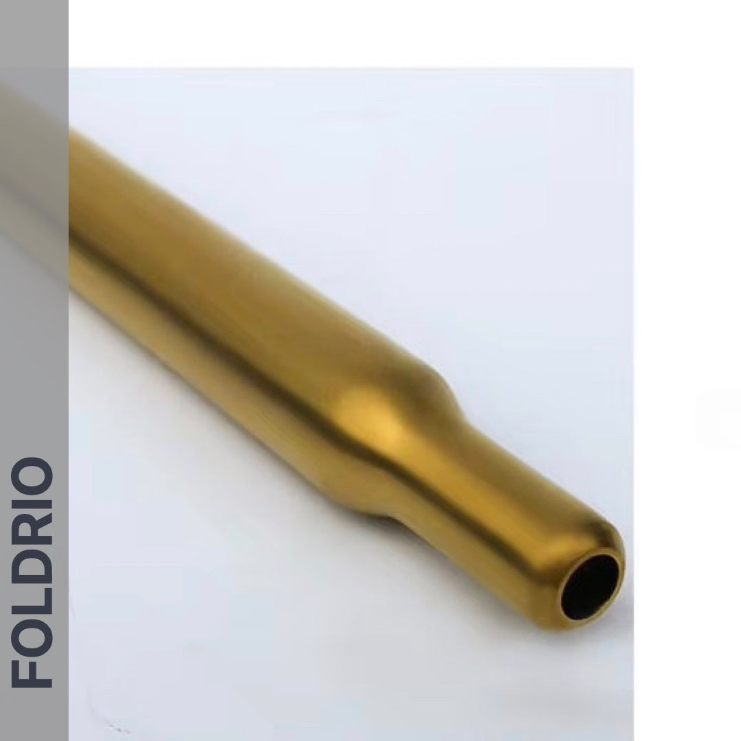 A multicolour Brompton Titanium Seatpost by FOLDRIO, cylindrical with a slight indent near one end, is shown on a white background. The FOLDRIO logo appears vertically along the left edge.