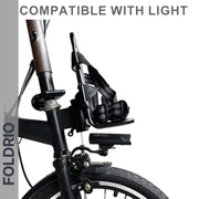 Side view of a Brompton Front Bag Rack Holder with elastic straps by FOLDRIO above the front wheel, featuring detachable straps—perfect for folding bikes. Compatible with lights and ideal for carrying bags conveniently.