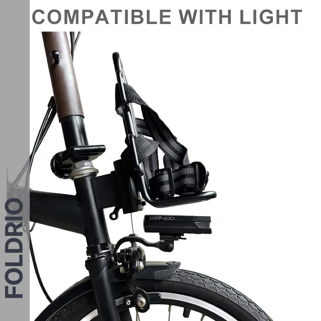 Side view of a Brompton Front Bag Rack Holder with elastic straps by FOLDRIO above the front wheel, featuring detachable straps—perfect for folding bikes. Compatible with lights and ideal for carrying bags conveniently.