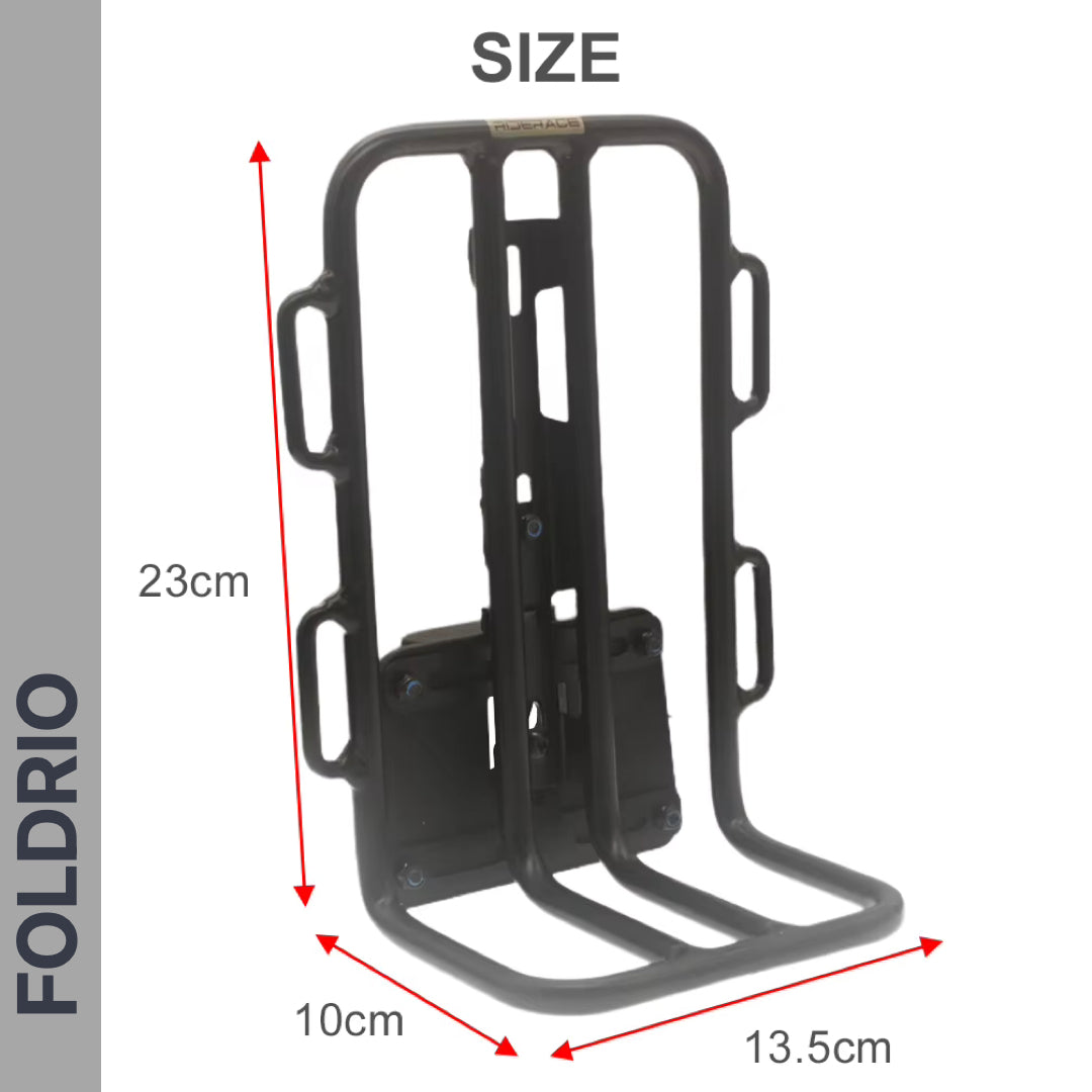 FOLDRIO Brompton Front Bag Rack Holder with Elastic Straps, black metal, three vertical slots, side handles. Stands upright; dimensions: 23 cm tall x 13.5 cm wide x 10 cm deep. "FOLDRIO" marked vertically on the left.