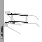 A black FOLDRIO Brompton Rear Rack Elastic Strap, designed for AC Line (old) & PT Line (new), is shown on a white background attached to a folding cart frame with two wheels. "FOLDRIO" appears vertically along a gray bar on the image's left side.