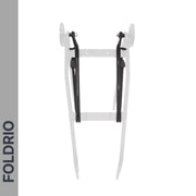A white bicycle rear rack with black support arms is mounted upright on a white background. "FOLDRIO" appears vertically on a gray bar to the left. Compatible with Brompton Rear Rack Elastic Straps – fits AC Line (old) & PT Line (new), by FOLDRIO.
