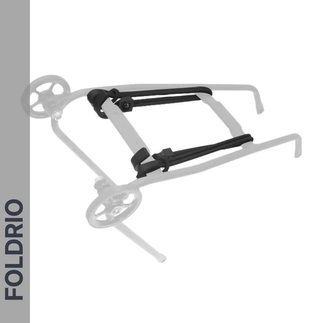 A stroller frame with wheels appears in solid and faded outlines. "FOLDRIO" is shown vertically on a gray strip, referencing the smart design of FOLDRIO’s Brompton Rear Rack Elastic Straps for AC Line (old) & PT Line (new).
