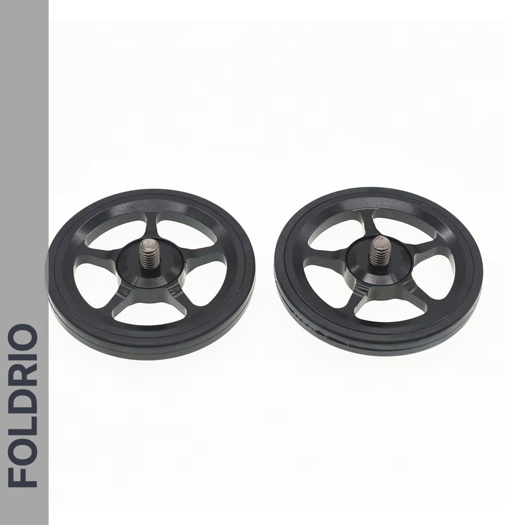 Brompton Brompton black CNC alloy Easy Wheels with spokes and bolts, shown side by side; FOLDRIO brand bar on left | Foldrio. Foldrio