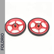 Brompton Brompton red alloy Easy Wheels with black rubber edges and central bolts on white, FOLDRIO branding visible | Foldrio. Foldrio