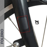 Brompton Brompton black fork with FOLDRIO protective sticker, red dashed border, partial wheel and brake, "FOLDRIO" on side | Foldrio. Foldrio