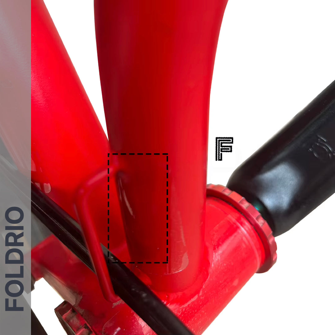 Brompton Brompton red frame close-up shows a scratch spot where Full Frame Film protects; FOLDRIO branding on left | Foldrio. Foldrio
