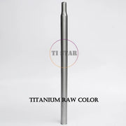 A metallic cylindrical tube, the FOLDRIO Brompton Titanium Seatpost – Multicolour Edition, stands upright against a plain white background.