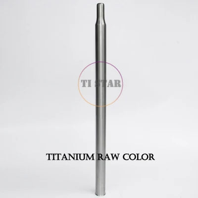 A metallic cylindrical tube, the FOLDRIO Brompton Titanium Seatpost – Multicolour Edition, stands upright against a plain white background.